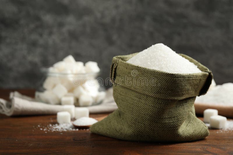Granulated Sugar in Sack on Wooden Table. Space for Text Stock Image