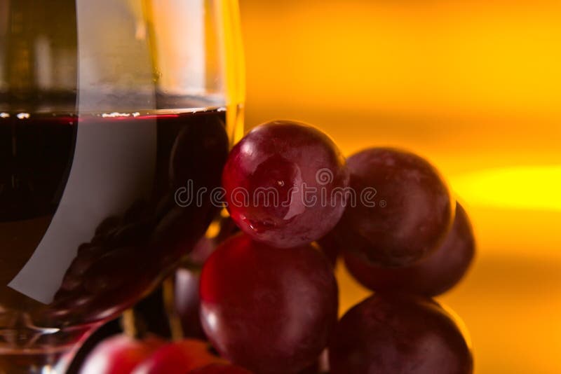 Grape and glass with red wine