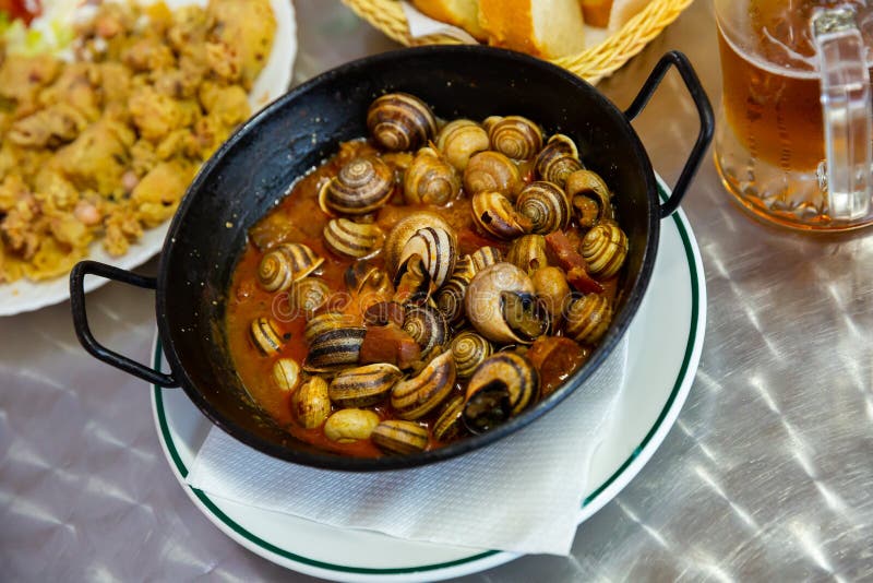 Spanish Cooked Snails In Sauce Stock Photo Image of meal, edible