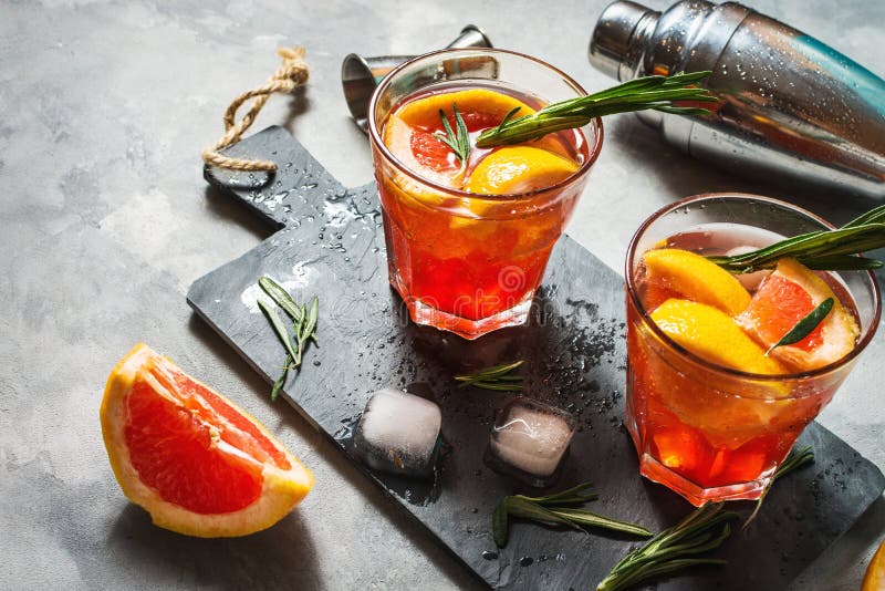 Grapefruit and Rosemary Gin Cocktail, Refreshing Drink with Ice Stock