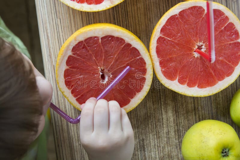 Grapefruits on the table and baby