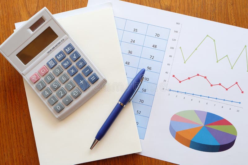 Graph paper and calculator stock image. Image of certificate 97420619