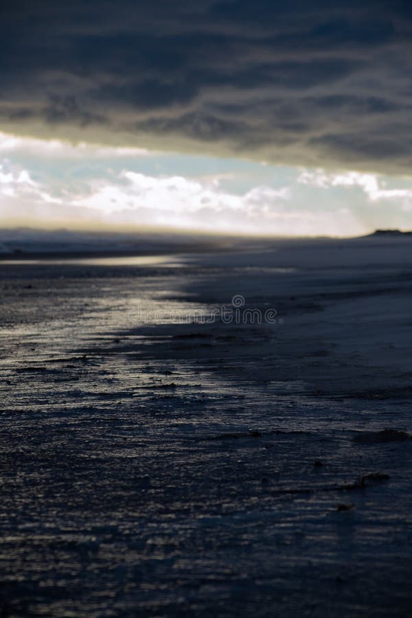 Dark Beach Portrait Landscape with Yellow Sun Highlights Stock ...
