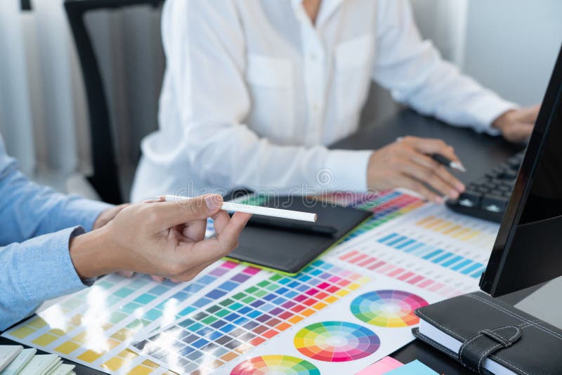 Graphic Designer Team Working on Web Design Using Color Swatches