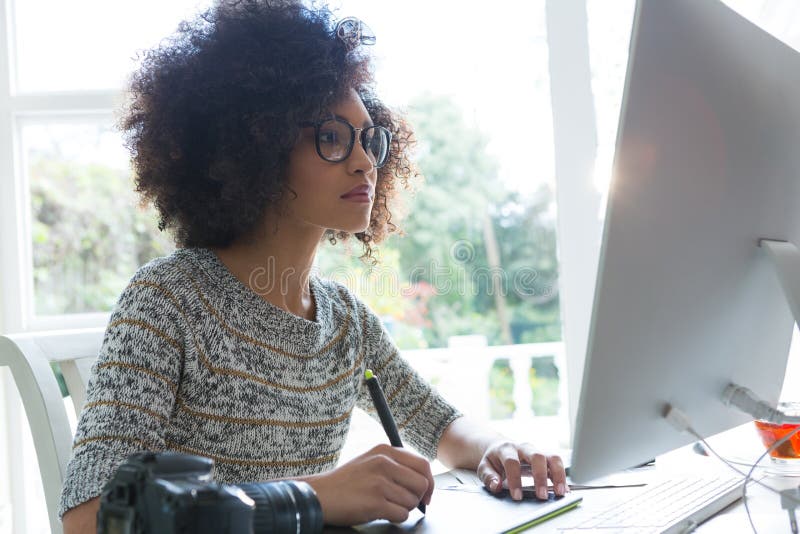 Graphic designer working on desktop pc royalty free stock image