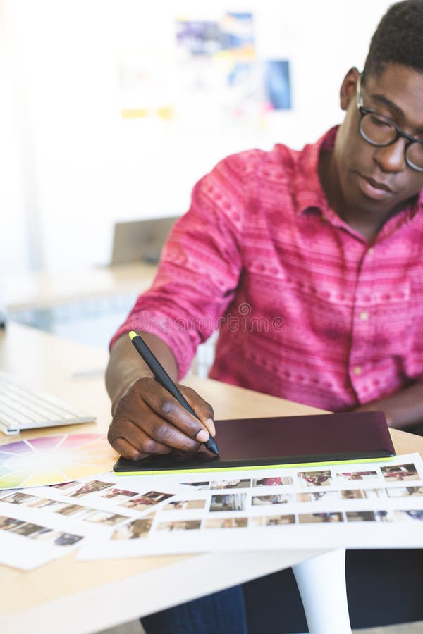 Graphic Designer Using Virtual Reality Headset in Office Stock Image