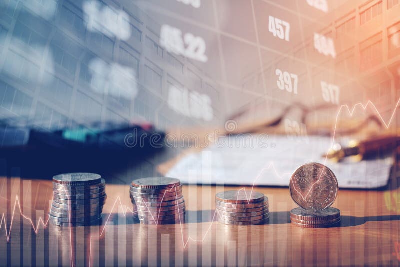 Graph on rows of coins for finance and banking on digital stock market financial exchange and Trading graph Double exposure city on the background. Graph on rows of coins for finance and banking on digital stock market financial exchange and Trading graph Double exposure city on the background.