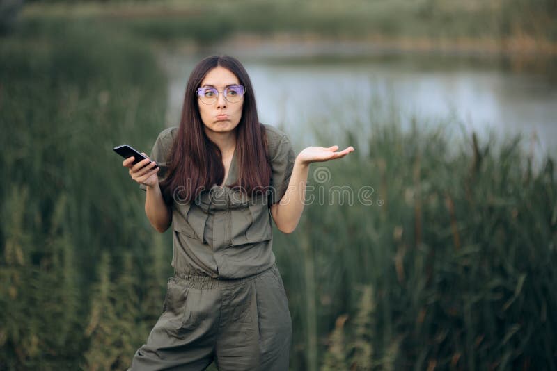 Disoriented girl trying to find a specific location in the wild. Disoriented girl trying to find a specific location in the wild