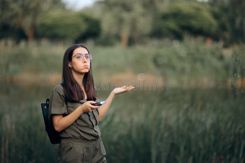 Disoriented girl trying to find a specific location in the wild. Disoriented girl trying to find a specific location in the wild