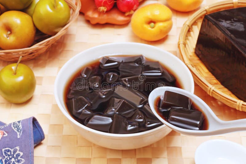 Grass Jelly In Syrup With Ice Cubes Leaf Jelly In Bowl On Wood Table