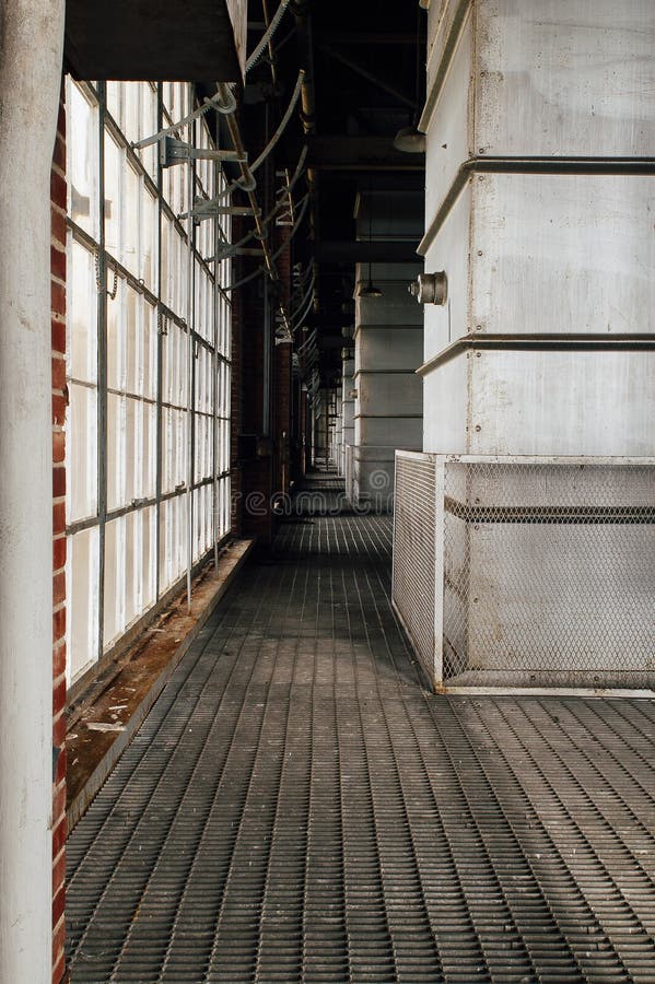 Grated Walkway between Windows Stock Photo - Image of abandoned