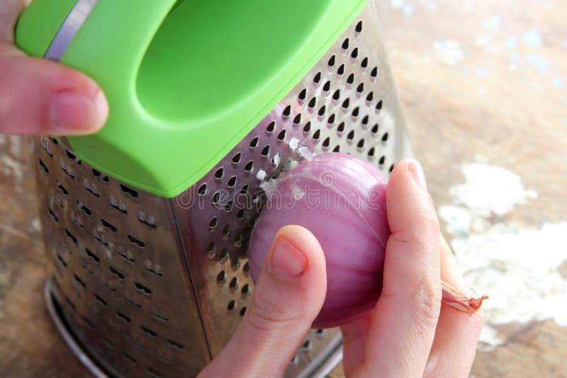 Grater with onion stock photo. Image of kitchenware, slicer - 68131652