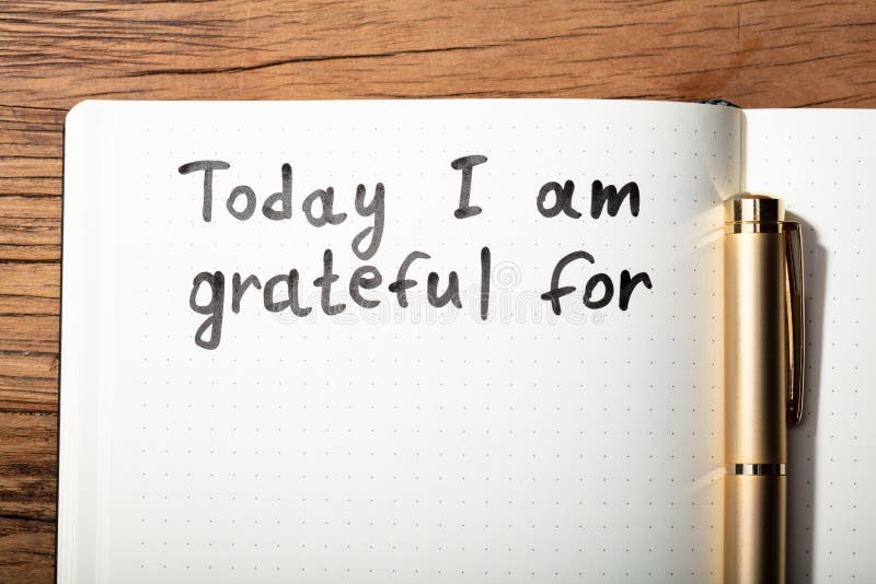 Gratitude Word With Pen On Notebook stock photos