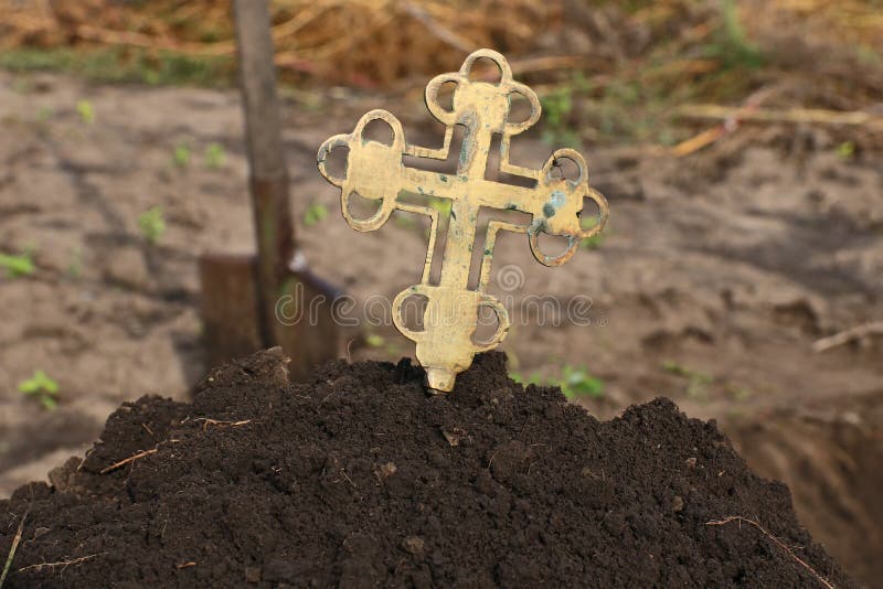 A Grave Cross Sticks Out Of A Pile Of Earth Stock Image Image Of