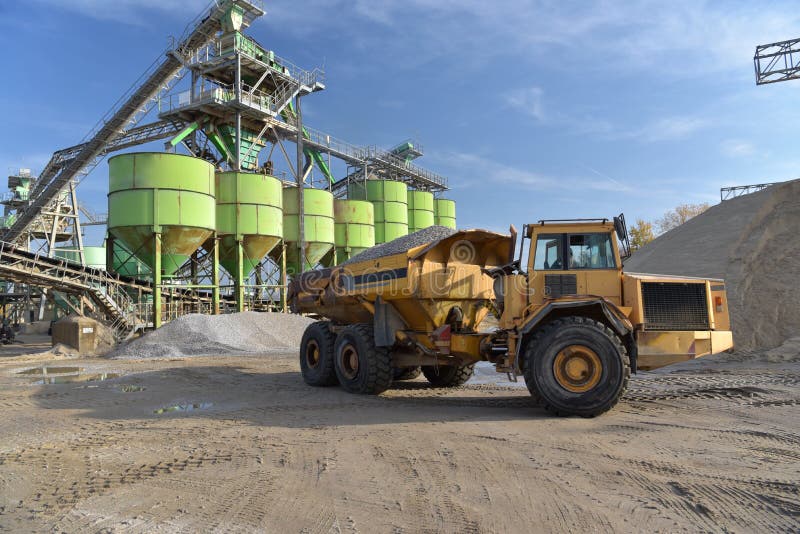 Gravel Pit Building and Wheel Loader Loading Gravel Onto a Truck Stock