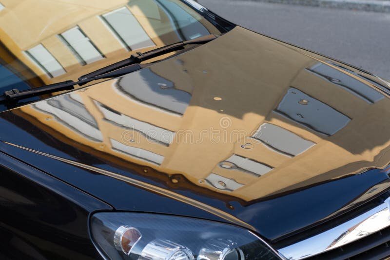 Serious hail storm damage on a parked car. Dented and damaged car after a hard hailstorm. Serious hail storm damage on a parked car. Dented and damaged car after a hard hailstorm.