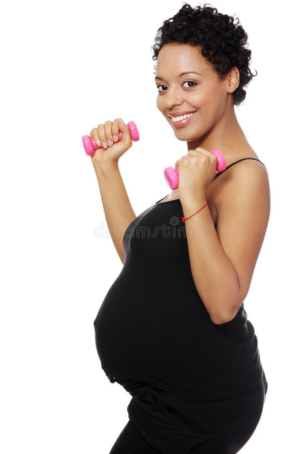 Gravid kvinna som excercising fotografering för bildbyråer Gravid kvinna som excercising fotografering för bildbyråer