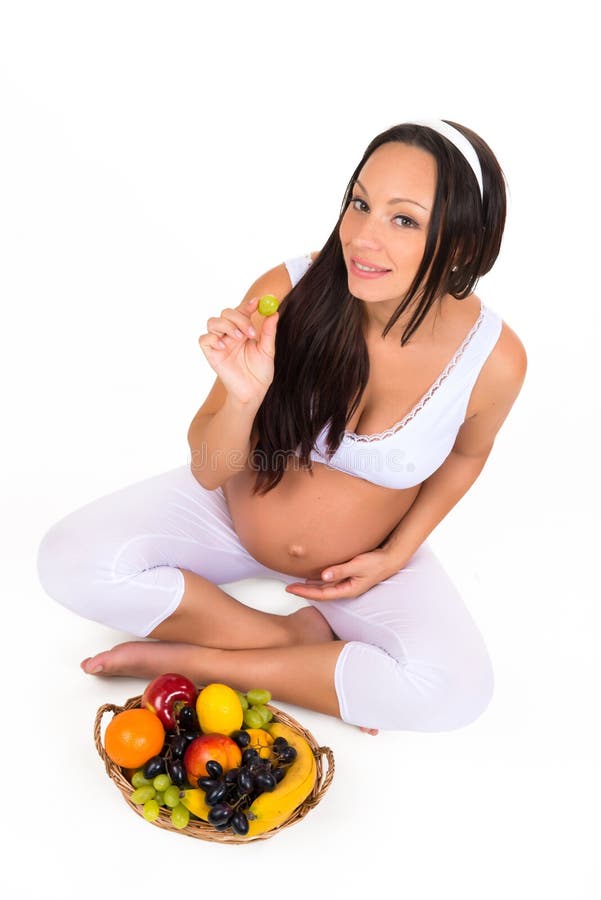Gravidanza, salute e bellezza Nutrizione adeguata Vitamine e frutta per le donne incinte immagine stock libera da diritti Gravidanza, salute e bellezza Nutrizione adeguata Vitamine e frutta per le donne incinte immagine stock libera da diritti