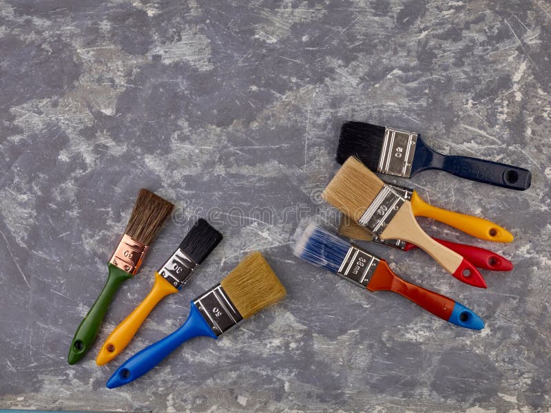 On a Gray Cement Background are Tools for Finishing Work,for Putty and