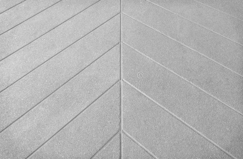 Gray concrete floor in line printed patterns texture on background