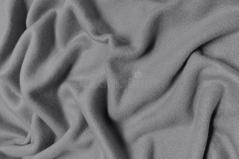 Gray wrinkled plush fabric background texture, soft material