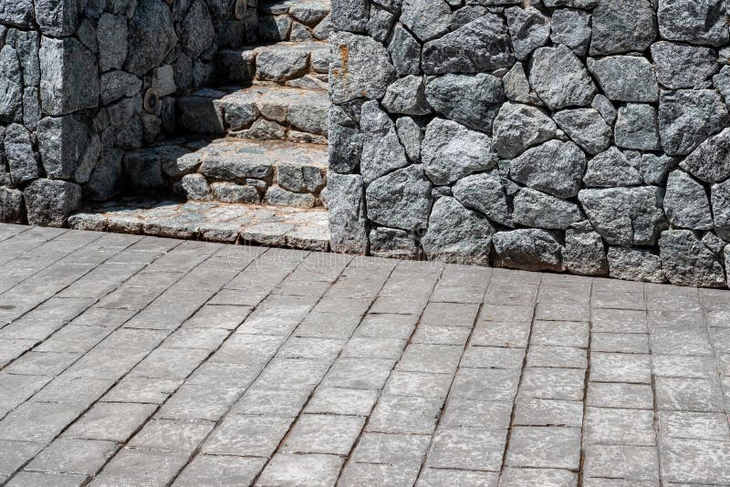 Gray Granite Stone Wall and Granite Staircase in the Park Stock Photo