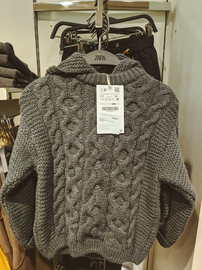 Gray Knitted Sweater with a Hood and a Price Tag on a Hanger Stock ...