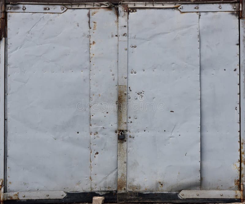 Red Metal Double Door, Old Garage Door, Paint Peeling Off Stock Photo