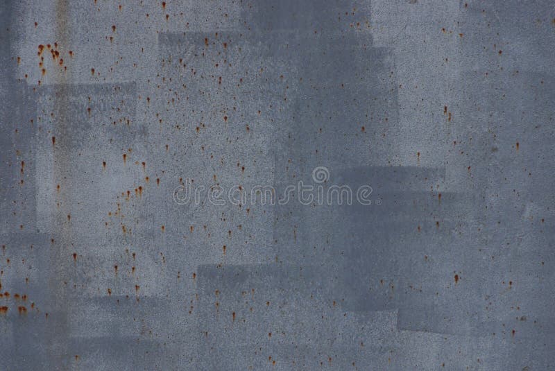 Gray metal background made of paint and rust stains on the old iron wall. Gray metal background made of paint and rust stains on the old iron wall