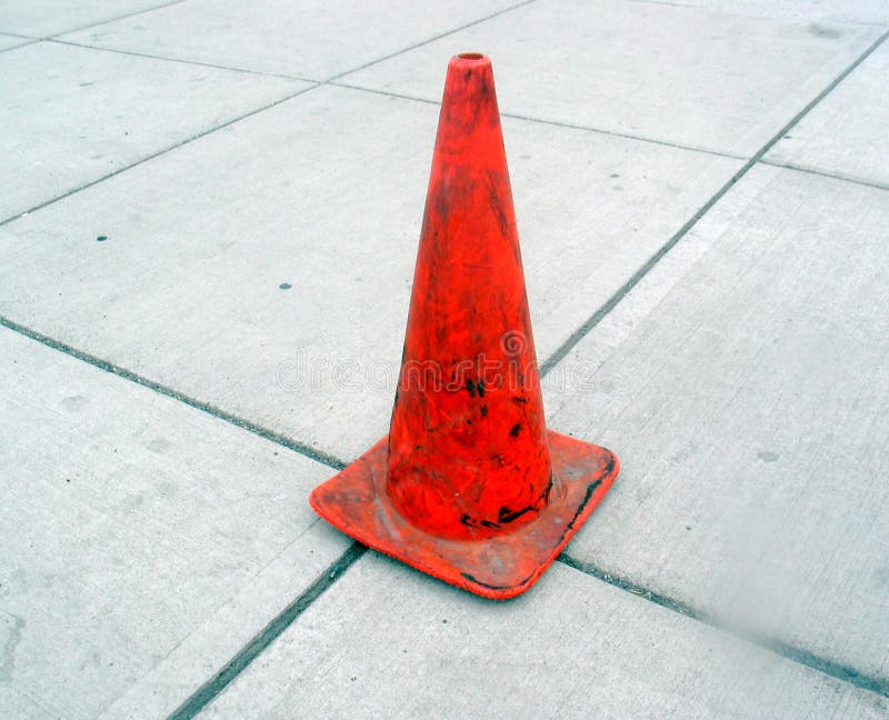Gray Sidewalk and Orange Cone