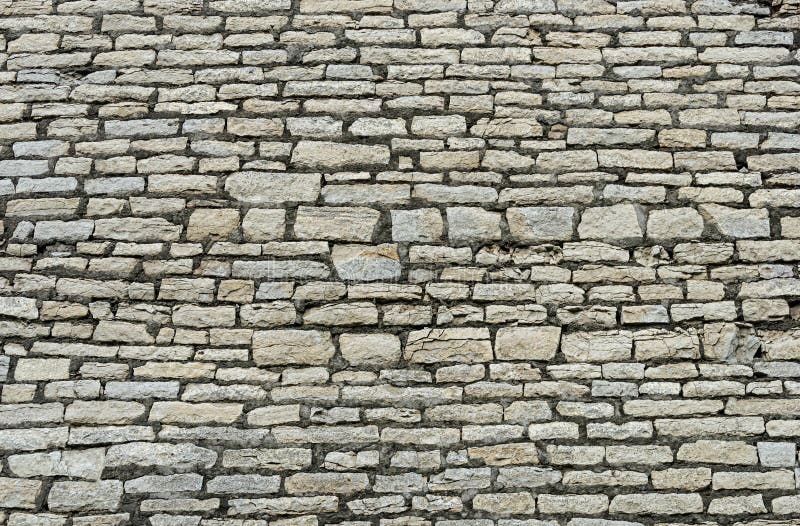 Texture of ancient gray city wall in Pskov, Russia. Texture of ancient gray city wall in Pskov, Russia