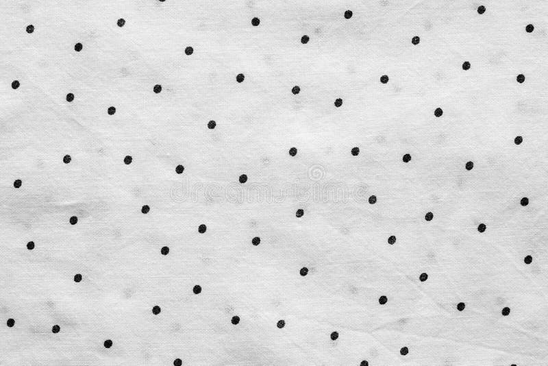 Gray textured background of fabric in peas