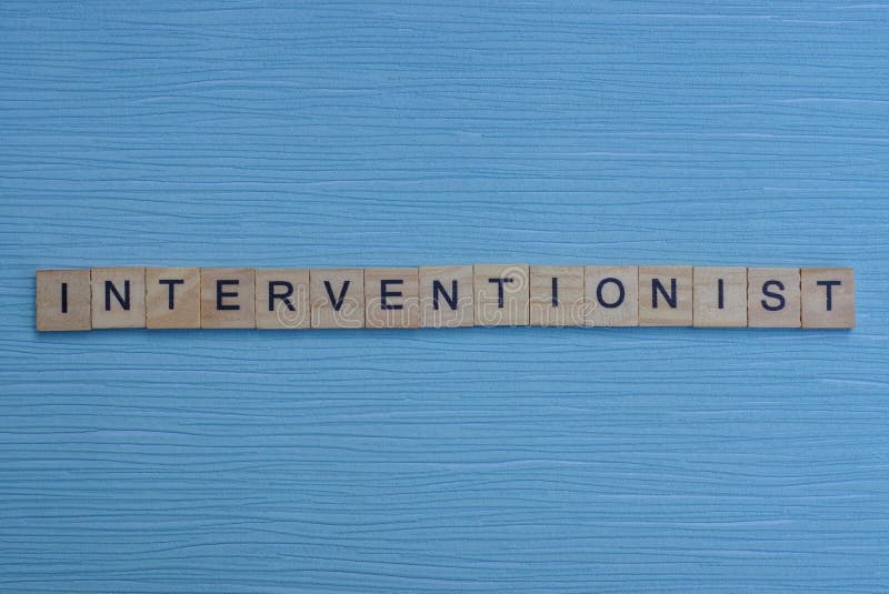 Gray word interventionist from small wooden letters on a blue table