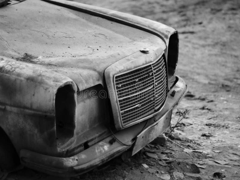 Grayscale of an Old Car Hood on the Muddy Ground Stock Image Image of