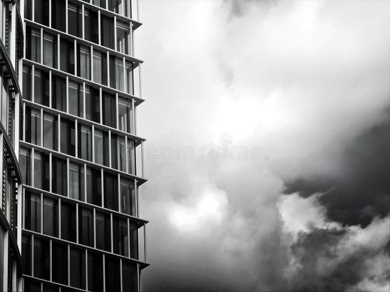 Grayscale photo of man standing near window photo – Free Cloud