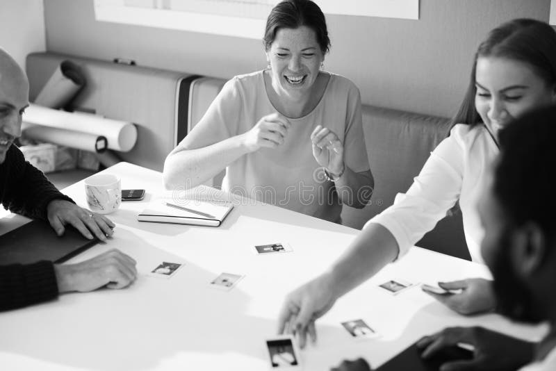 Grayscale Photography Of Four Person Having A Discussion Picture. Image