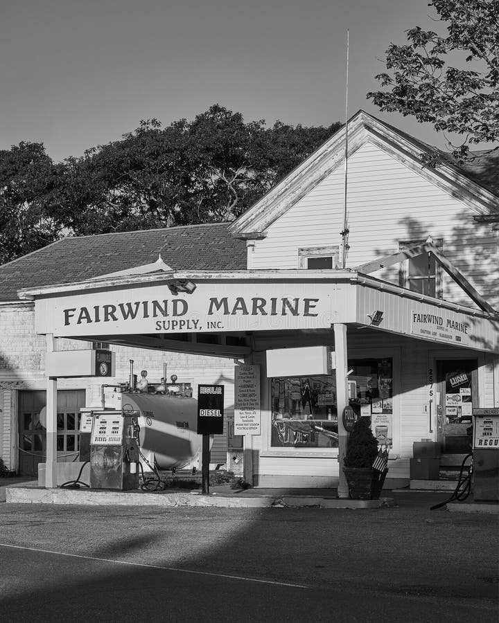 Grayscale Shot of a Fairwind Marine Gas Station in the Daylight
