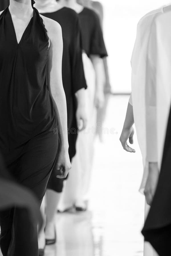 Grayscale Shot of Fashion Models Walking the Catwalk during a Fashion ...