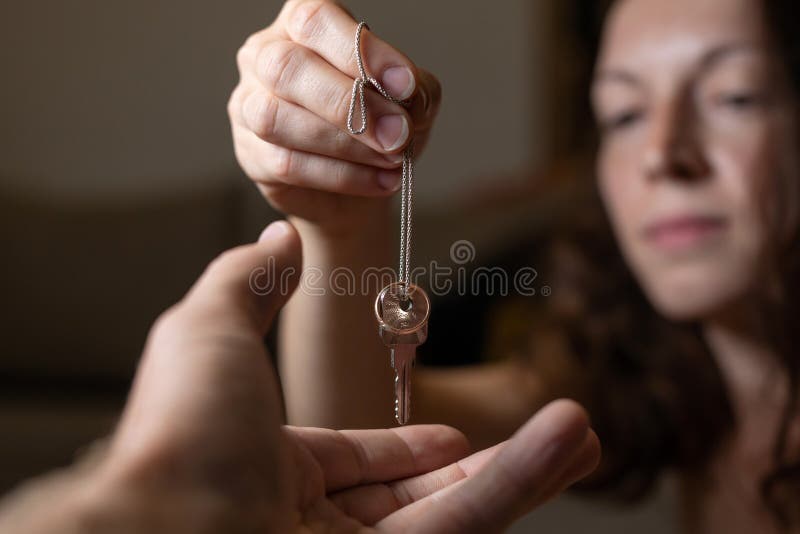 Great concept of divorce, ending of relationship. Closeup of sad wife after divorce. woman returned key to shared housing and wedding ring to husband in a house interior, couple, break, marriage, agreement, spouse, fight, family, affair, unhappy, upset, problem, heartbroken, quarrel, stress, female, breakup, heartbreak, married, mistake, lady, love, shame, death, bereavement, dead, cheating, desperate, prenuptial, engagement, crisis, document, property, partner, realty, estate, divide. Great concept of divorce, ending of relationship. Closeup of sad wife after divorce. woman returned key to shared housing and wedding ring to husband in a house interior, couple, break, marriage, agreement, spouse, fight, family, affair, unhappy, upset, problem, heartbroken, quarrel, stress, female, breakup, heartbreak, married, mistake, lady, love, shame, death, bereavement, dead, cheating, desperate, prenuptial, engagement, crisis, document, property, partner, realty, estate, divide