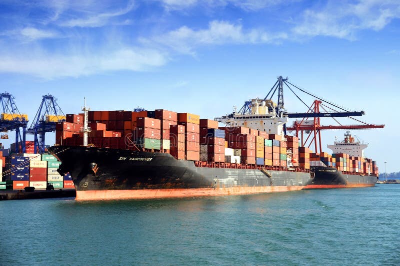 Big container ship ZIM VANCOUVER working in the port of Valencia.