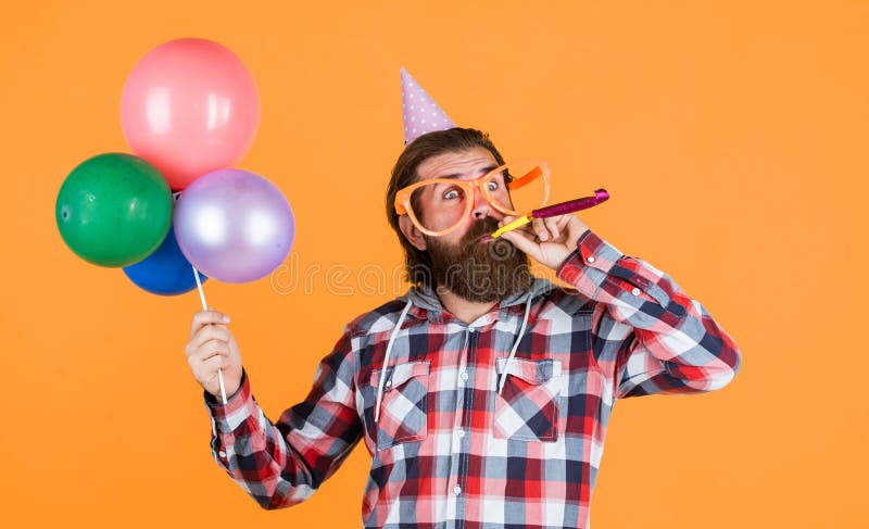 Great day for shopping. best party for retirement. cheerful man with beard and moustache. hipster smiling with balloon