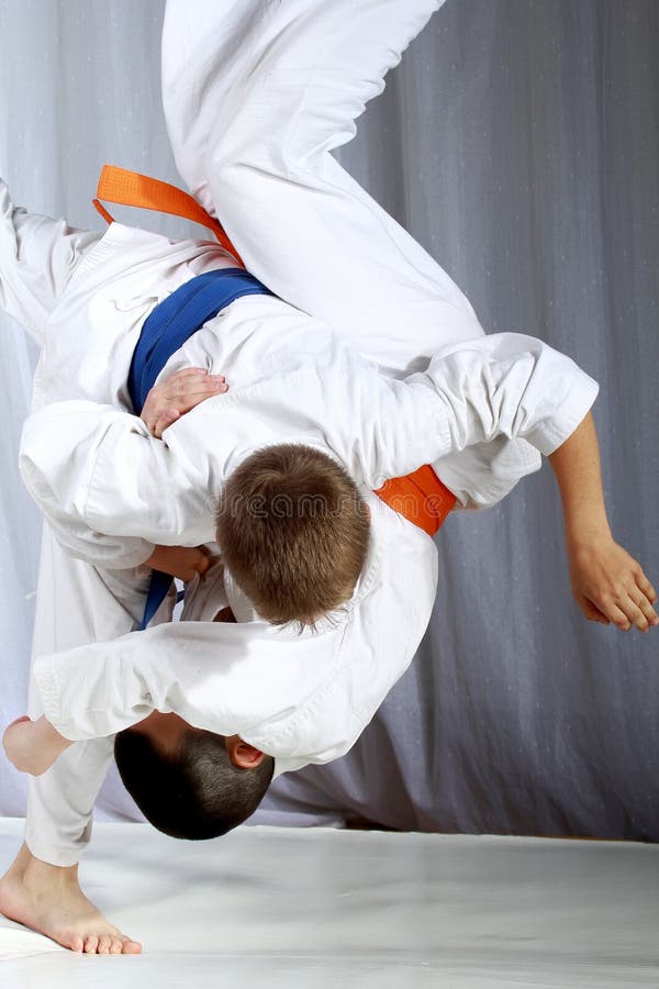 A Boy with a Blue Belt and a Cap of Santa Claus Hits a Kick Leg Stock Image Image of judo