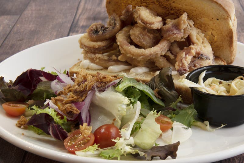 A Great Sandwich of Fried Calamari Typical of Spanish Bars Stock Photo