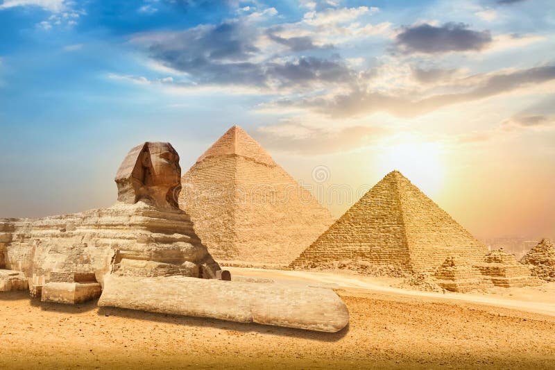 The Great Sphinx and Pyramids against colorful sunset sky in Giza, Cairo, Egypt