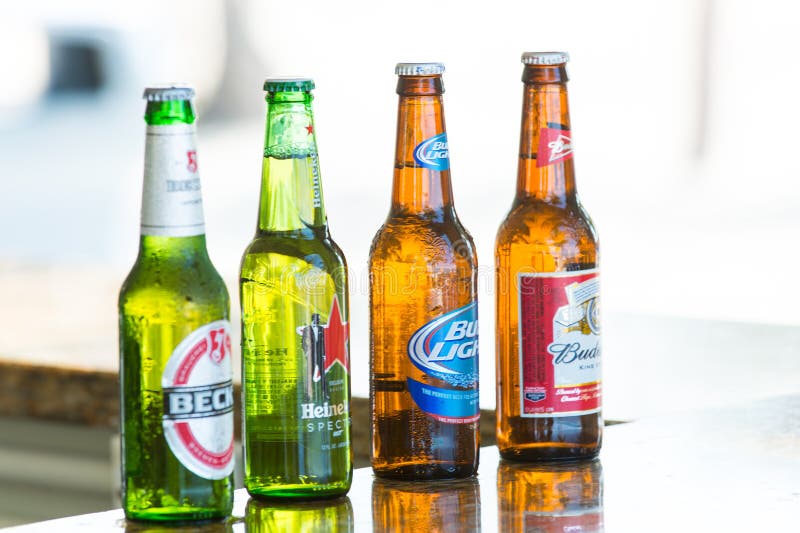 Great stirrup cay, Bahamas - January 08, 2016: beer in glass bottles on bar counter. Alcohol, bad habits. Refreshment, drink, beve