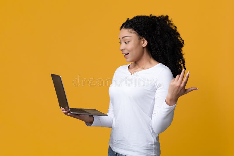 Premium Photo  Lucky day emotional black woman looking at laptop clenching  fists and screaming working at cafe copy space