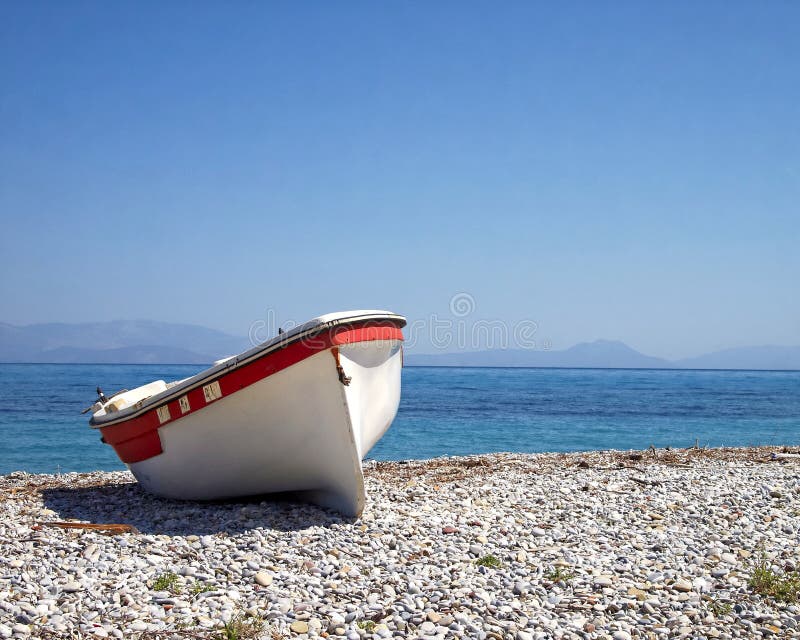 Greece, small boat on the beach stock images Greece, small boat on the beach stock images