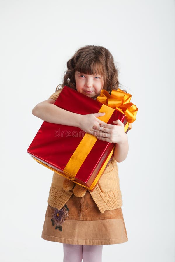 Greedy girl with a gift royalty free stock photo Greedy girl with a gift royalty free stock photo