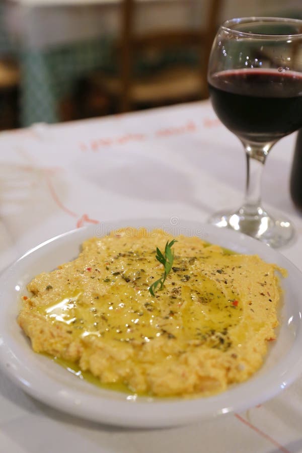 Greek dish of mushed salty cheese and spices. Homemade, lunch.