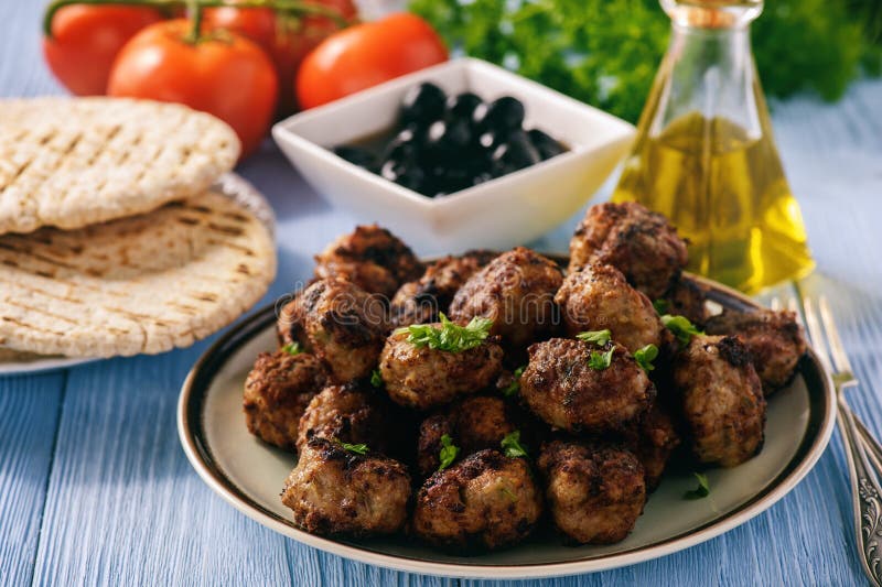 Greek meatballs keftedes with pita bread and tzatziki dip.